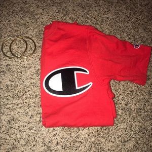 Red champion shirts gold earrings